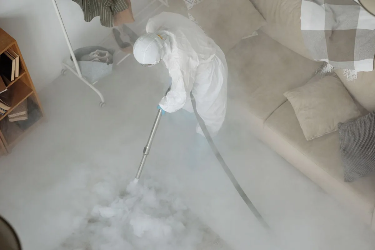 Biohazard cleanup technician in protective equipment, Excelsior, MN